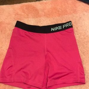 Pink and black nike pro shorts
